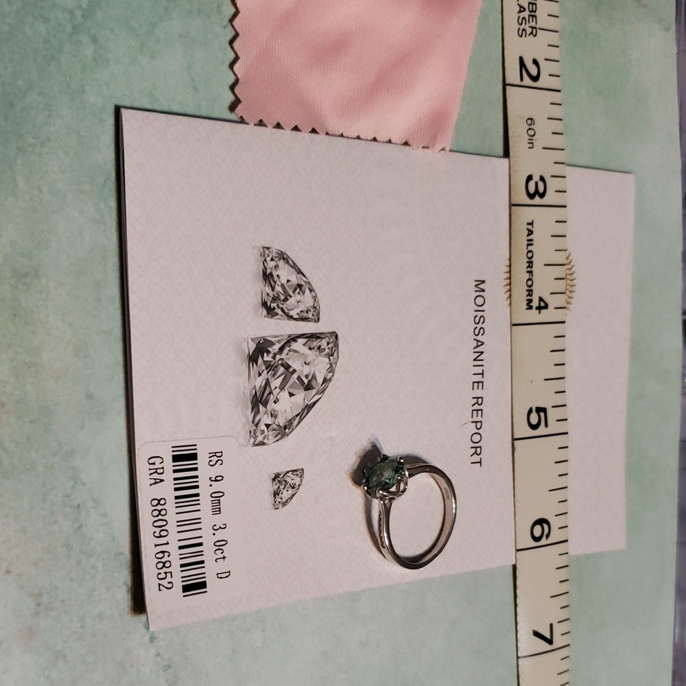 Sophisticated Silver Moissanite Ring.  Blue Stone